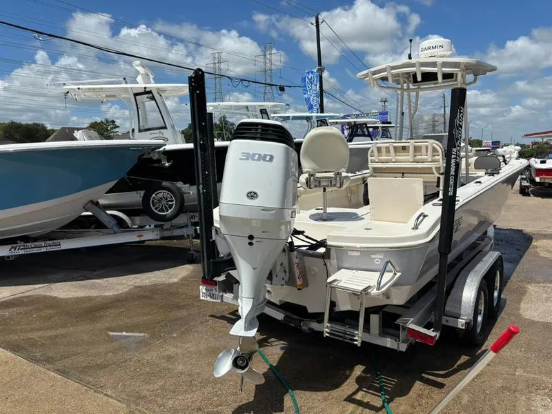 Slide: The Image of 2022 Carolina Skiff 26 Ultra Elite boat on trailer, featuring a 300 HP engine. - 4