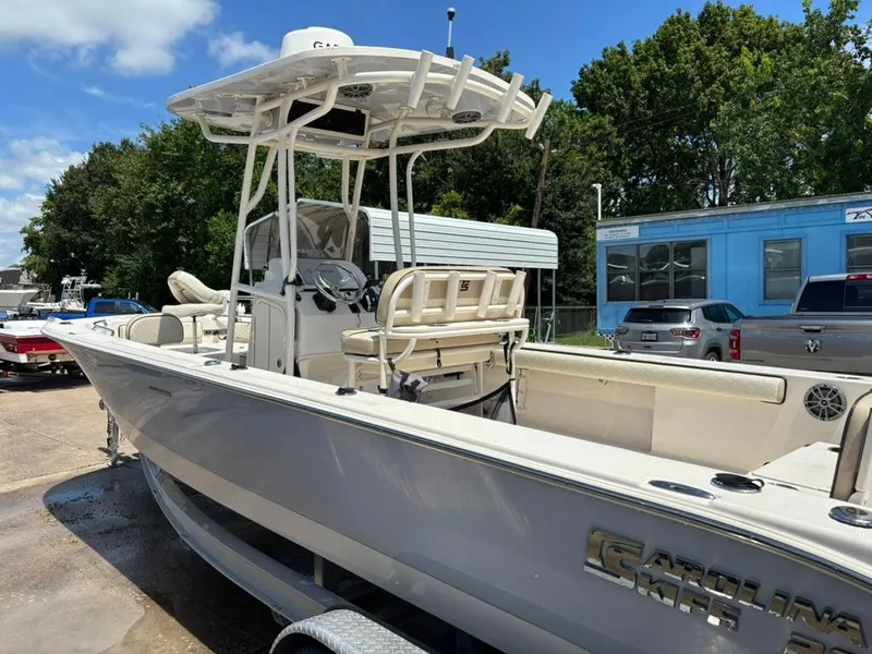 Slide: The Image of 2022 Carolina Skiff 26 Ultra Elite boat on trailer, parked outdoors. - 5