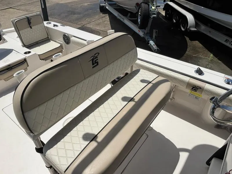 Slide: The Image of 2022 Carolina Skiff 26 Ultra Elite boat interior with beige seating and diamond stitching. - 8