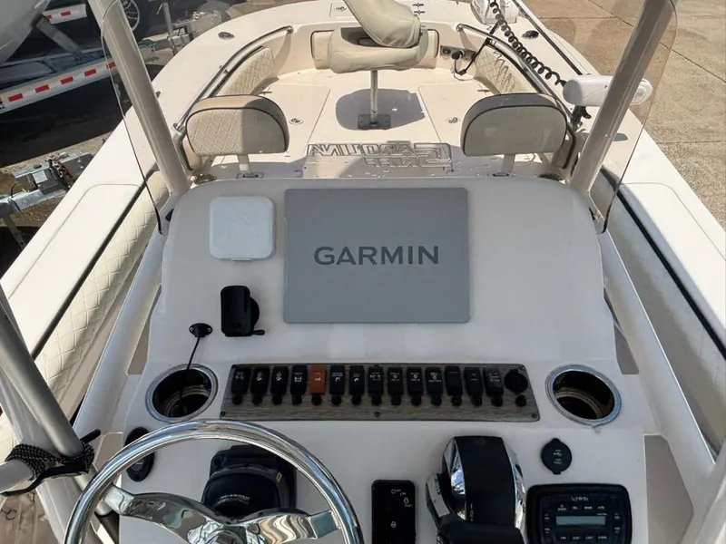 Slide: The Image of 2022 Carolina Skiff 26 Ultra Elite boat dashboard with Garmin navigation system. - 9