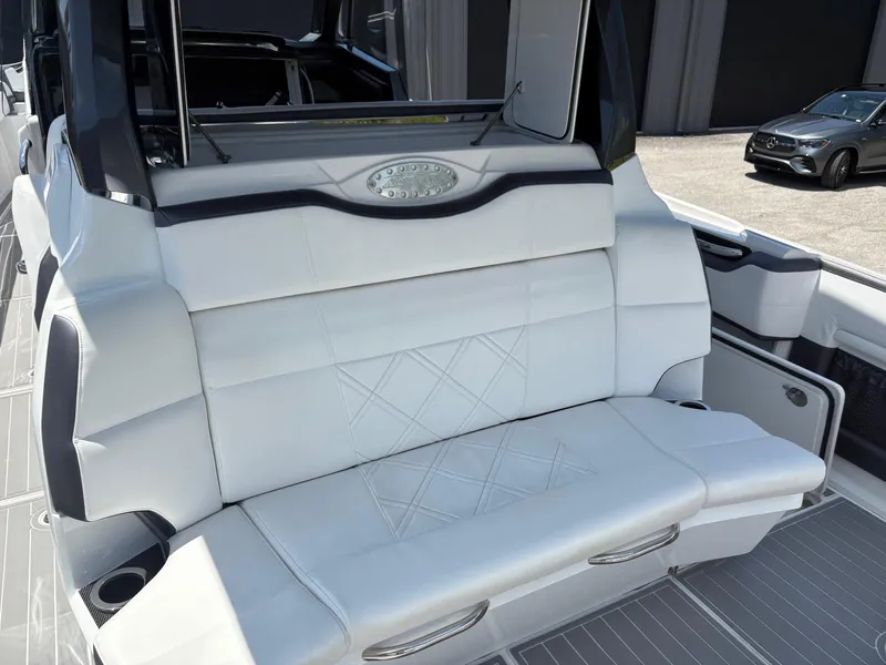 Slide: The Image of 2020 Nor-Tech 450 Sport Center Console with luxurious white seating and modern design. - 11