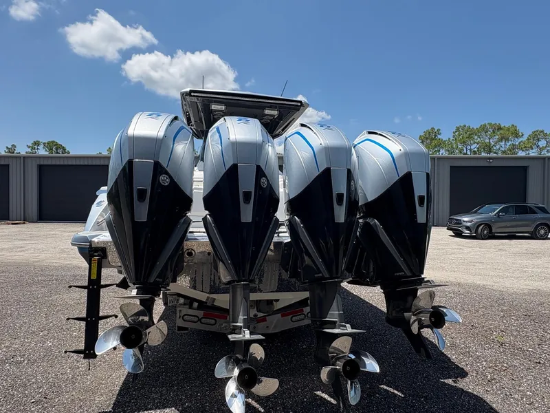 Slide: The Image of 2020 Nor-Tech 450 Sport Center Console with four powerful outboard engines. - 5