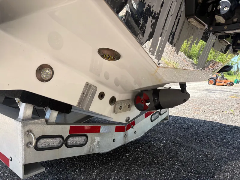 Slide: The Image of 2020 Nor-Tech 450 Sport Center Console boat on trailer, showing hull and underwater lights. - 6