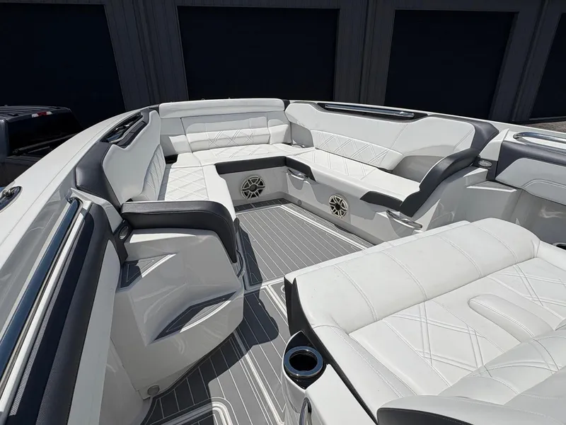Slide: The Image of 2020 Nor-Tech 450 Sport Center Console with luxurious white seating and modern design. - 7