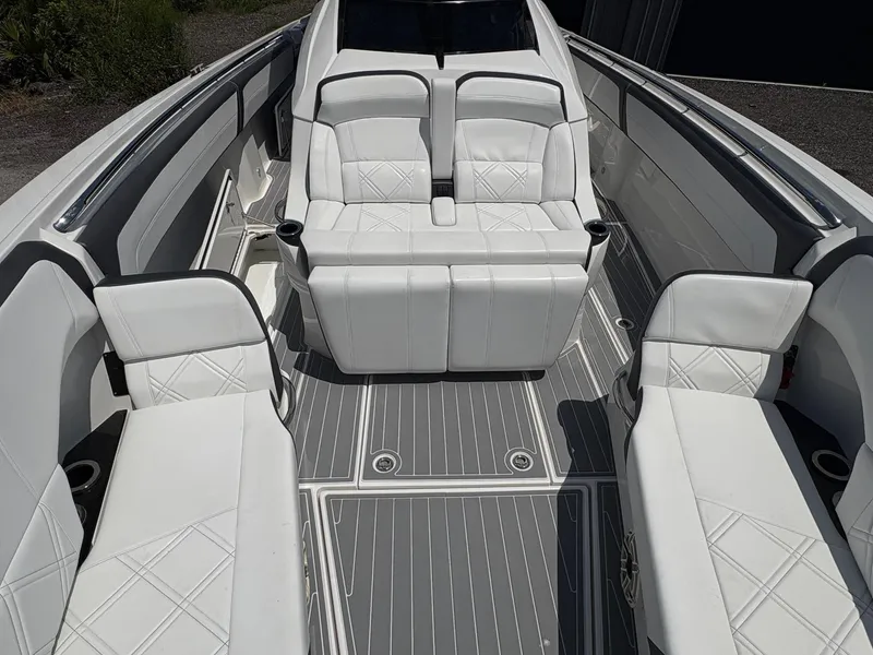 Slide: The Image of 2020 Nor-Tech 450 Sport Center Console interior with white seating and sleek design. - 9