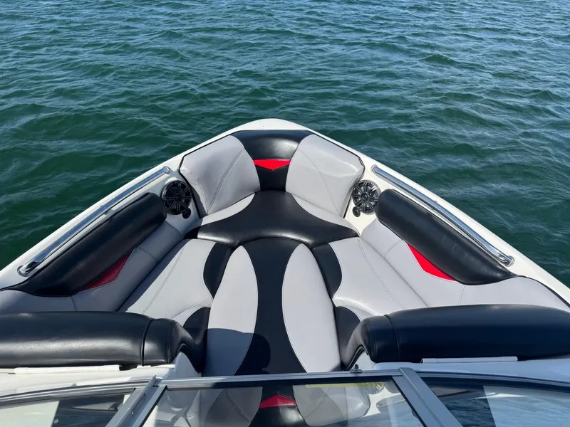 Slide: The Image of 2006 Tigé 22V boat interior with stylish seating on open water. - 5