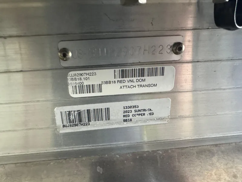 Slide: The Image of 2023 Sun Tracker Bass Buggy 18 DLX identification plate with barcodes and serial numbers. - 11