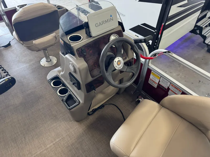 Slide: The Image of 2023 Sun Tracker Bass Buggy 18 DLX boat interior with Garmin navigation system. - 17