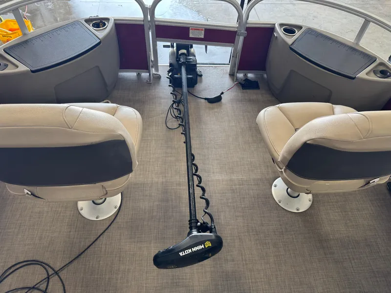 Slide: The Image of Interior of 2023 Sun Tracker Bass Buggy 18 DLX with seating and trolling motor. - 6