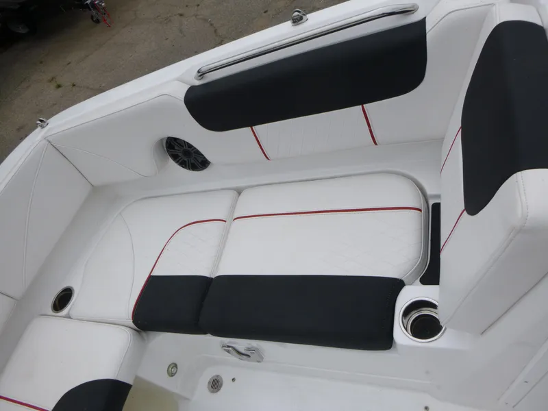 Slide: The Image of White and black seating on 2022 Tahoe 1950 boat, featuring cup holders and speaker. - 12