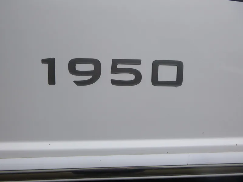 Slide: The Image of Close-up of Tahoe 1950 model emblem on white surface, 2022. - 15