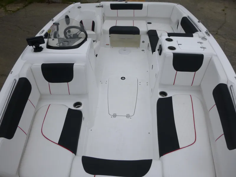 Slide: The Image of Interior of 2022 Tahoe 1950 boat with white and black seating. - 6