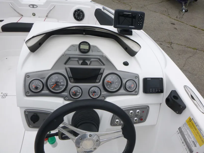 Slide: The Image of Dashboard of a 2022 Tahoe 1950 boat with gauges and navigation equipment. - 8