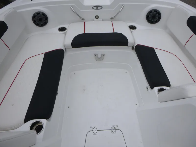 Slide: The Image of Interior seating of a 2022 Tahoe 1950 boat, featuring black and white upholstery. - 9