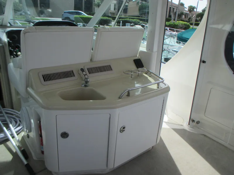 Slide: The Image of 2005 Sea Ray 390 Motor Yacht cockpit sink and storage area. - 14