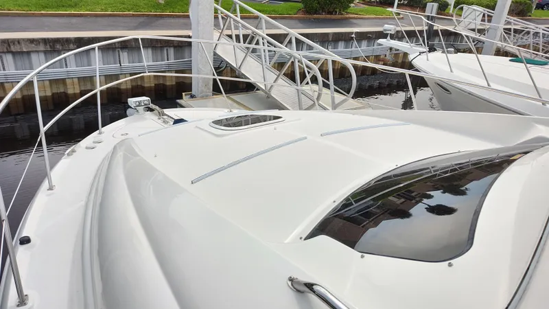 Slide: The Image of 2005 Sea Ray 390 Motor Yacht docked at marina, view of bow and deck. - 15