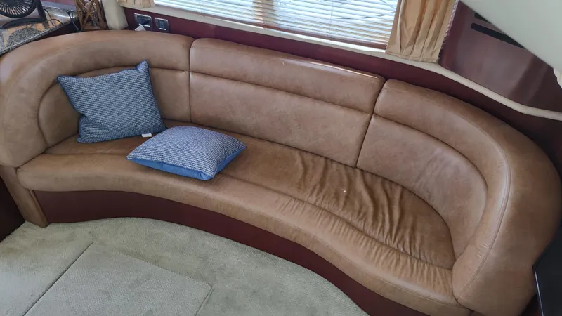 Slide: The Image of Leather seating area in 2005 Sea Ray 390 Motor Yacht with blue cushions. - 29