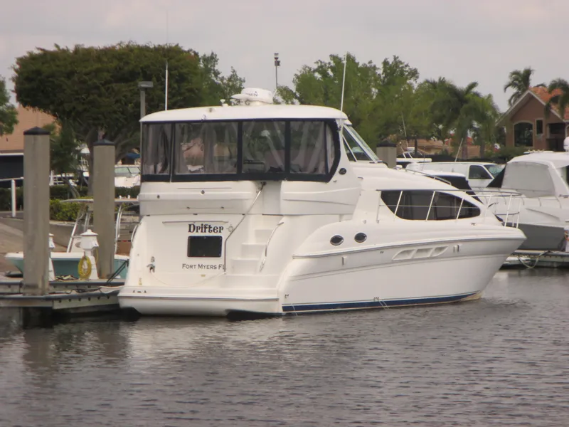 Slide: The Image of 2005 Sea Ray 390 Motor Yacht docked at a marina on a sunny day. - 3
