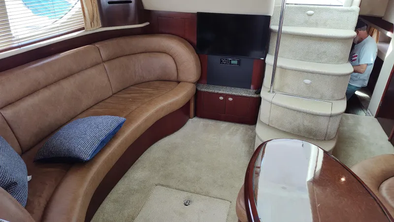 Slide: The Image of Luxurious interior of 2005 Sea Ray 390 Motor Yacht with curved leather seating. - 31