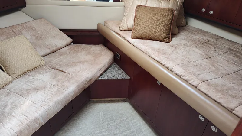 Slide: The Image of 2005 Sea Ray 390 Motor Yacht interior cabin with twin beds and plush cushions. - 39