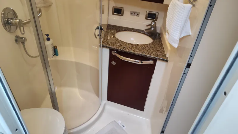 Slide: The Image of 2005 Sea Ray 390 Motor Yacht bathroom with shower, sink, and granite countertop. - 43