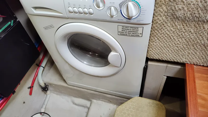 Slide: The Image of Washing machine installed in the 2005 Sea Ray 390 Motor Yacht laundry area. - 45