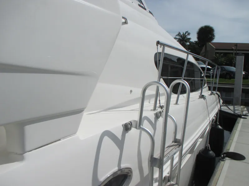 Slide: The Image of Side view of a 2005 Sea Ray 390 Motor Yacht docked at a marina. - 5