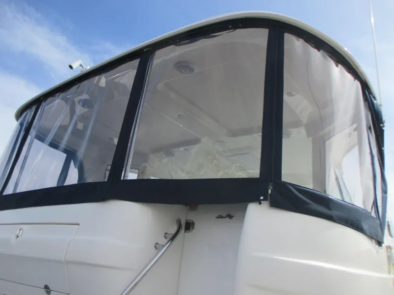 Slide: The Image of 2005 Sea Ray 390 Motor Yacht with enclosed cockpit and clear windows. - 7