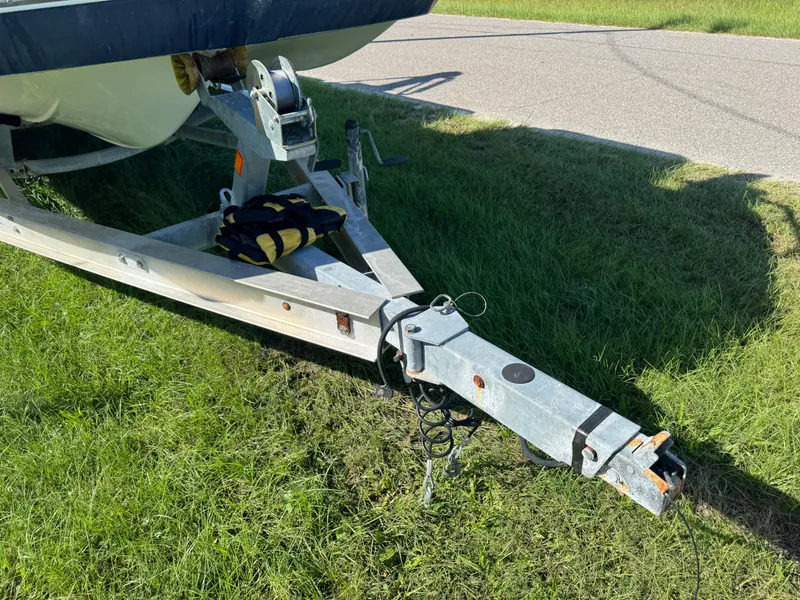 Slide: The Image of Trailer hitch of 2018 Hurricane FunDeck 226F OB boat on grass near road. - 18