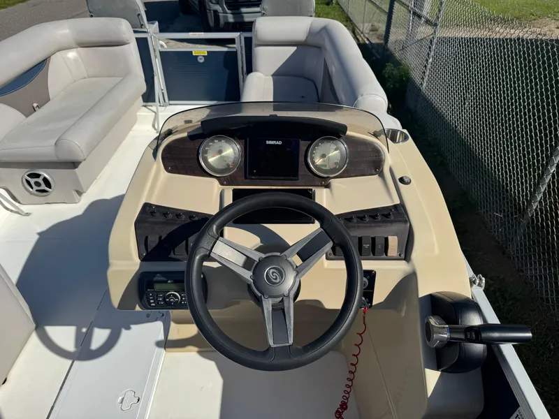 Slide: The Image of 2018 Hurricane FunDeck 226F OB boat dashboard with steering wheel and controls. - 4
