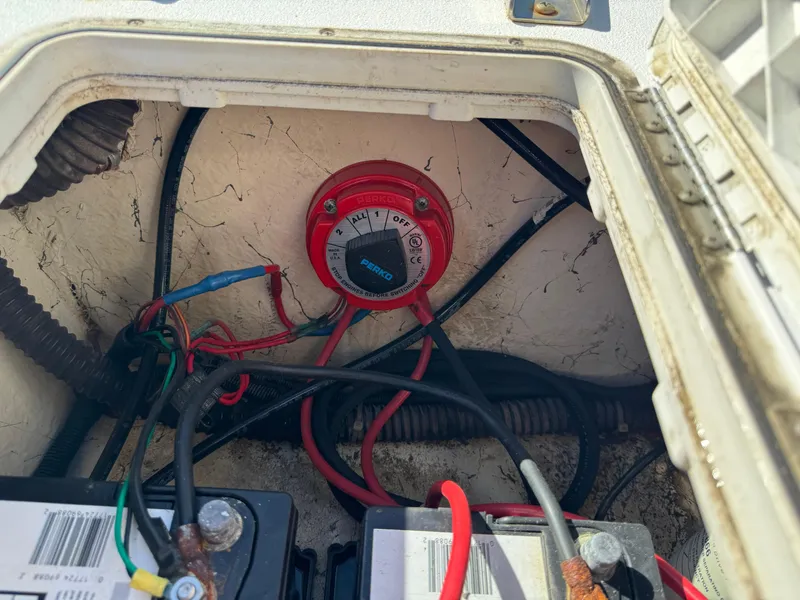 Slide: The Image of Battery compartment of 2018 Hurricane FunDeck 226F OB with Perko switch and wiring. - 8