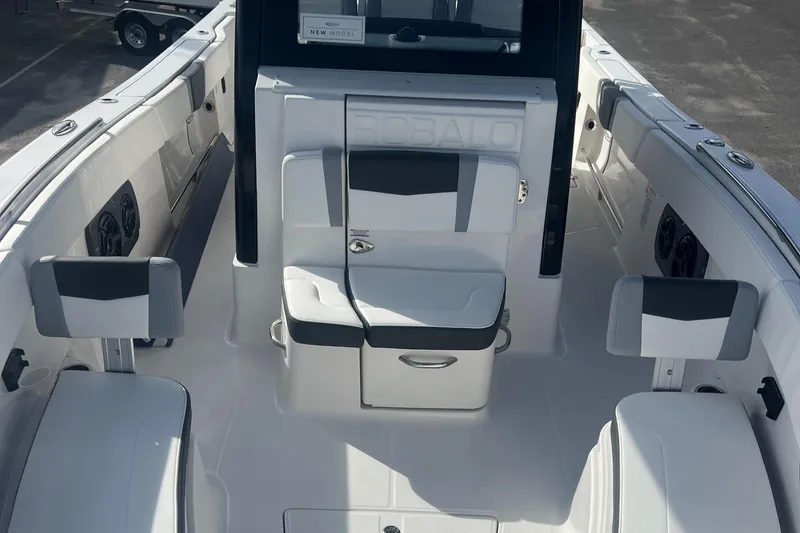 Slide: The Image of 2025 Robalo R300 Center Console boat interior with seating and storage. - 16