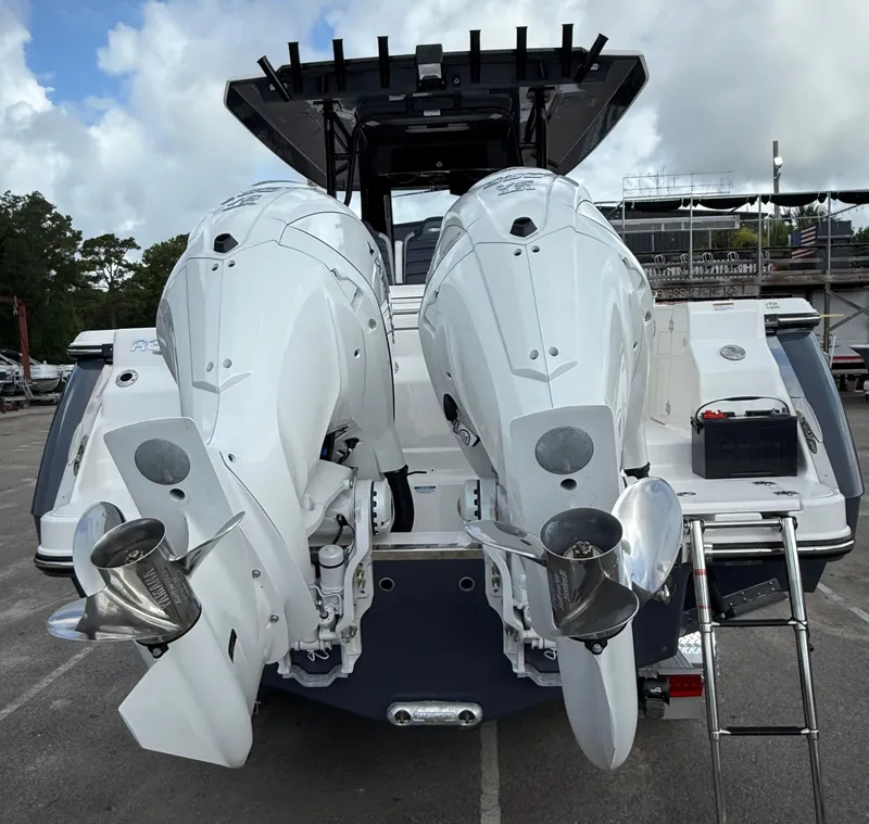 Slide: The Image of 2025 Robalo R300 Center Console with dual outboard engines, rear view. - 5