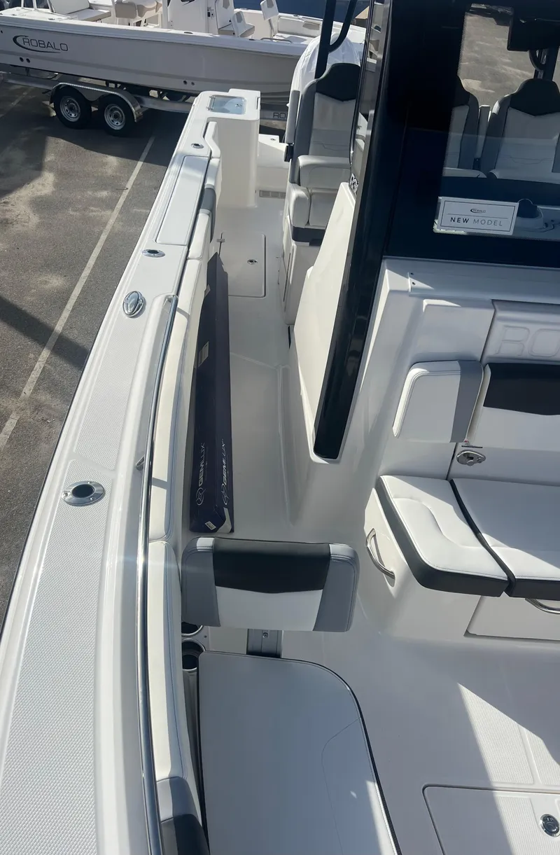 Slide: The Image of 2025 Robalo R300 Center Console boat interior, showcasing sleek seating and modern design. - 7