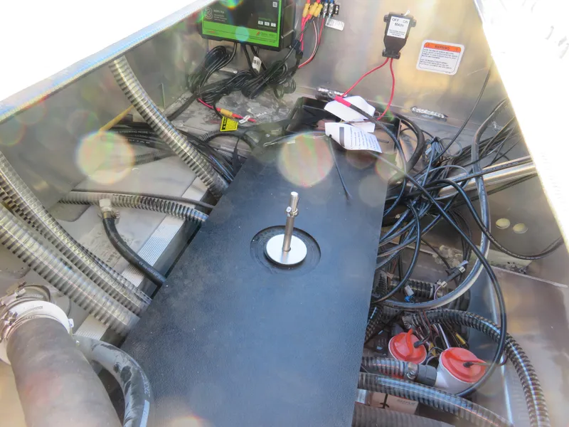 Slide: The Image of 2024 Ranger RB200 boat wiring and components in storage compartment. - 13