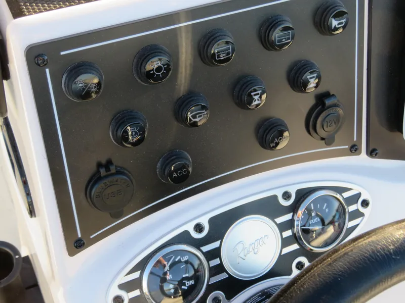 Slide: The Image of Control panel of 2024 Ranger RB200 boat with switches and gauges. - 4