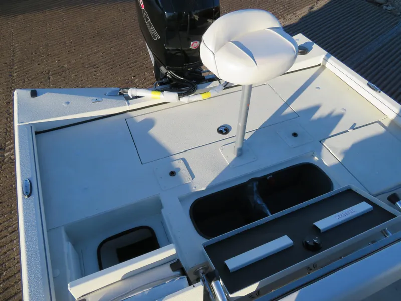 Slide: The Image of 2024 Ranger RB200 boat deck with seat and storage compartments. - 7
