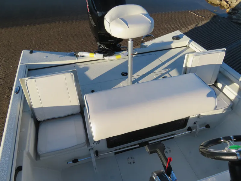 Slide: The Image of 2024 Ranger RB200 boat interior with white seating and steering wheel. - 8