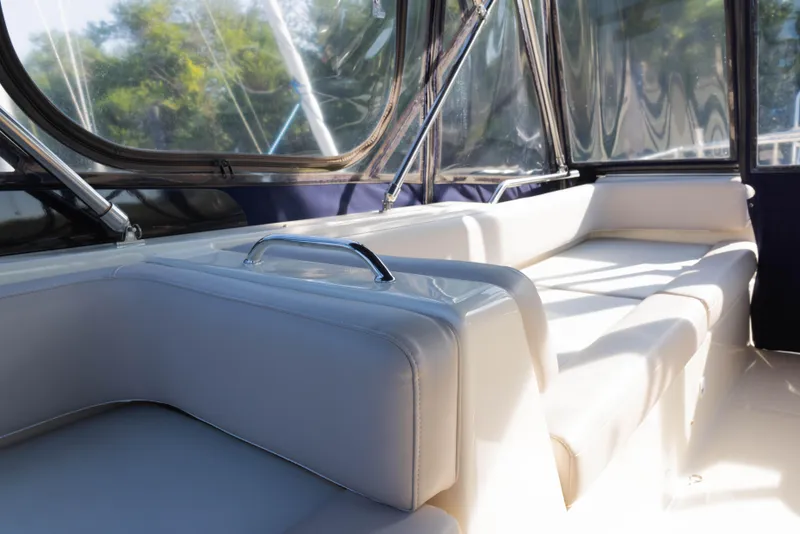 Slide: The Image of Interior seating of 2006 Mainship 400 Trawler with sunlight streaming through windows. - 37