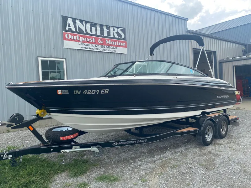 Slide: The Image of 2018 Monterey 224FS boat on trailer at Anglers Outpost & Marine dealership. - 3