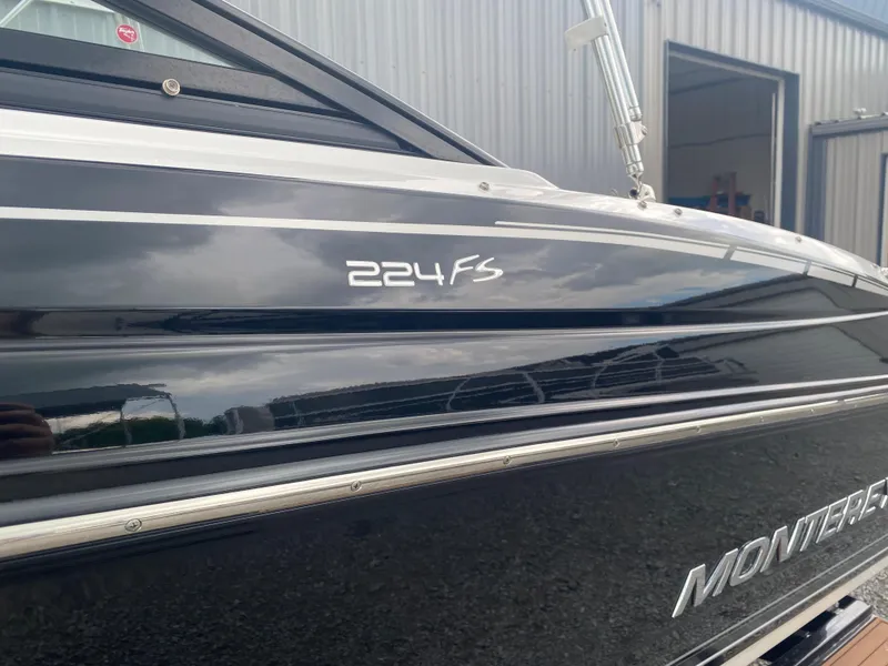 Slide: The Image of 2018 Monterey 224FS boat side view with model name and logo. - 5