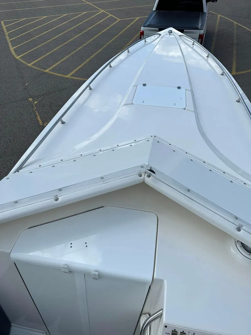 Slide: The Image of Bow view of a 1994 Fountain 35 Lightning boat in a parking lot. - 11