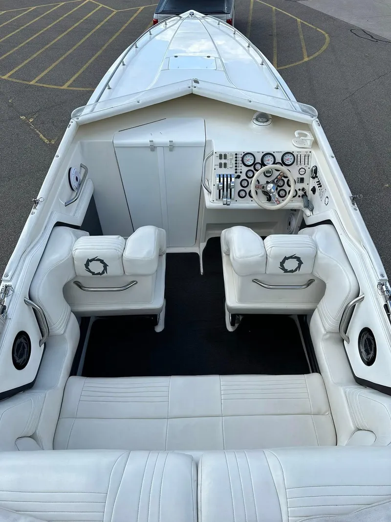 Slide: The Image of 1994 Fountain 35 Lightning boat interior with white seating and control panel. - 12