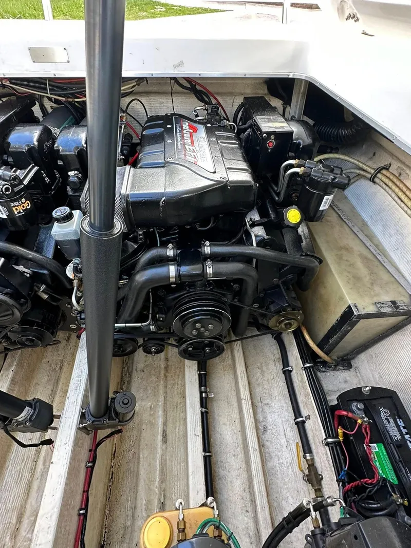 Slide: The Image of Engine compartment of a 1994 Fountain 35 Lightning boat, showcasing detailed mechanical components. - 24