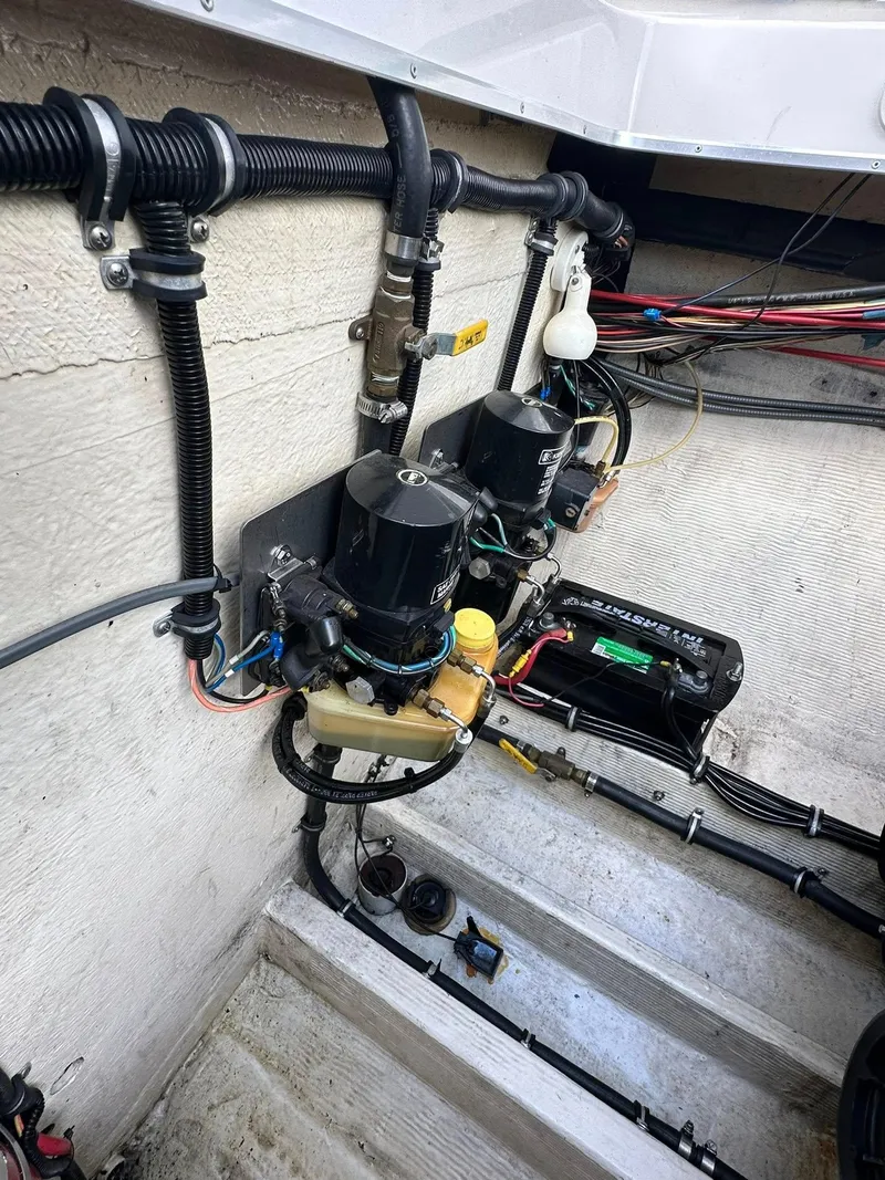 Slide: The Image of 1994 Fountain 35 Lightning engine compartment with wiring and mechanical components. - 25