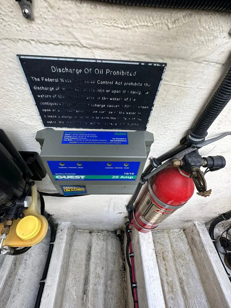Slide: The Image of Battery charger and fire extinguisher on a 1994 Fountain 35 Lightning boat. - 26