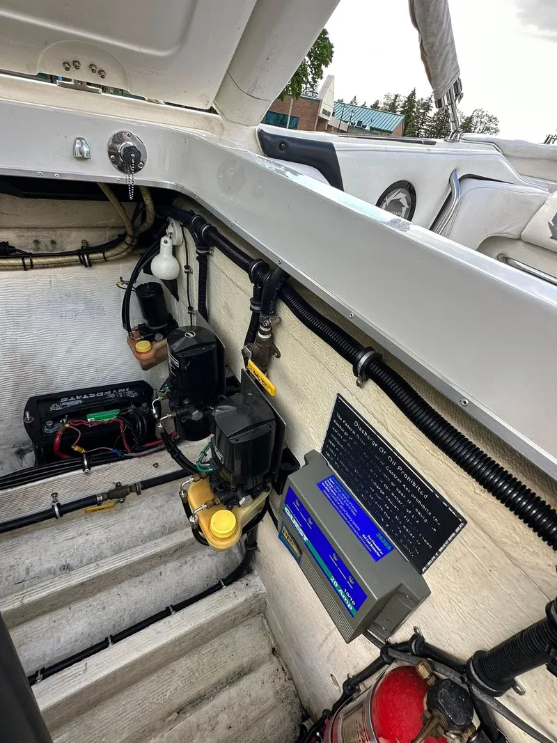 Slide: The Image of Engine compartment of a 1994 Fountain 35 Lightning boat, showing mechanical components and wiring. - 28