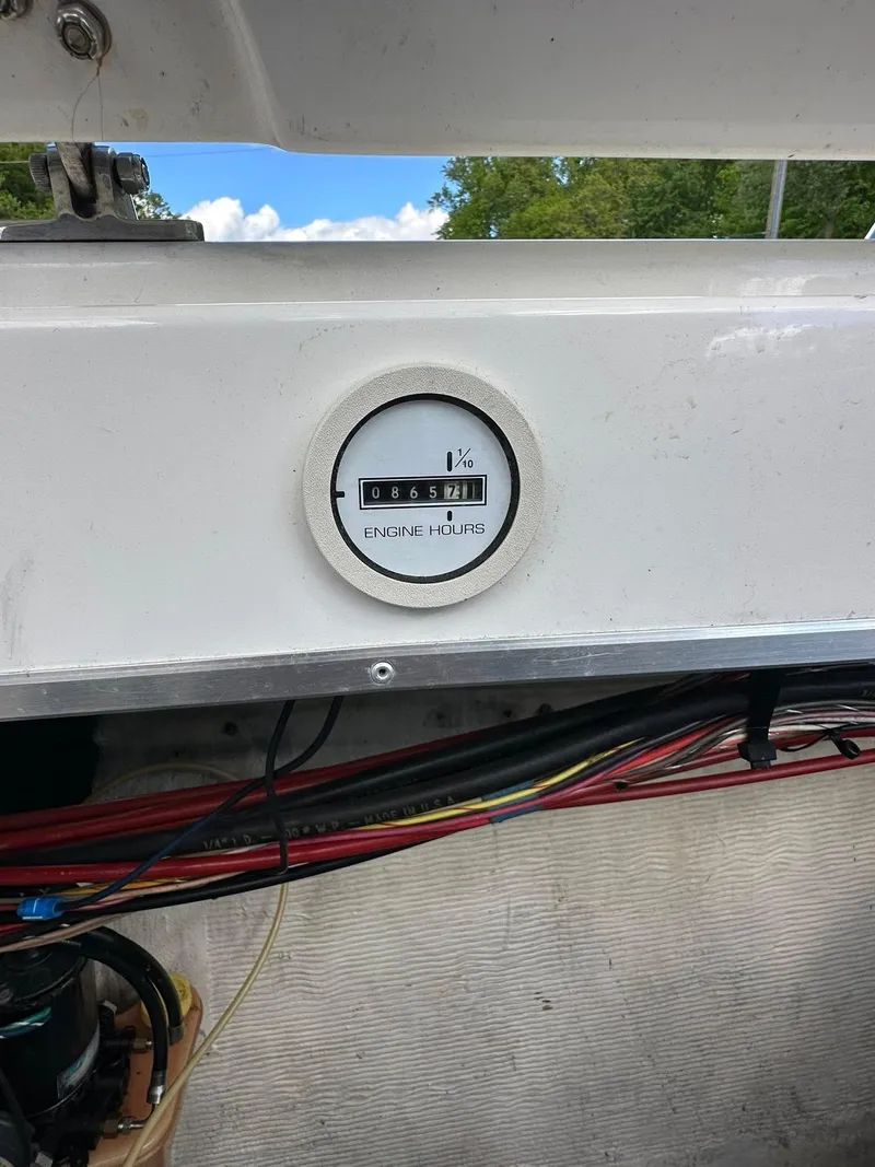 Slide: The Image of Engine hour meter on 1994 Fountain 35 Lightning boat, showing 865.7 hours. - 29