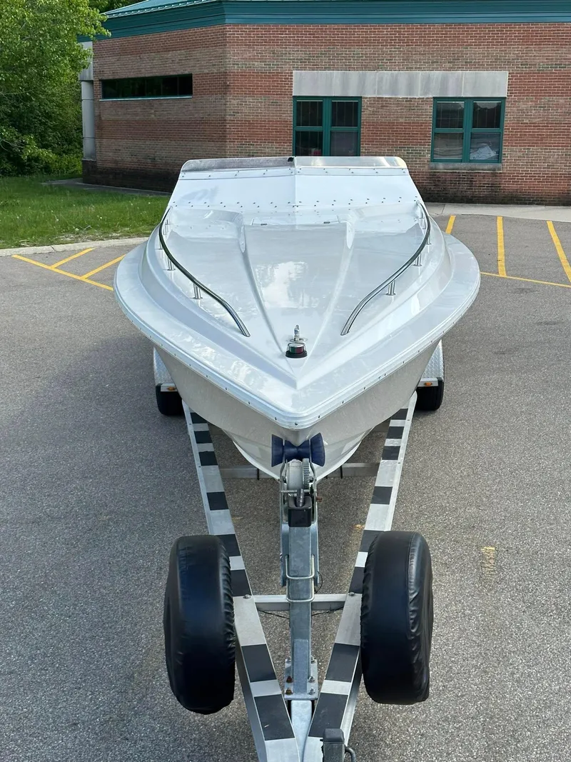 Slide: The Image of 1994 Fountain 35 Lightning boat on trailer, parked in a lot. - 5