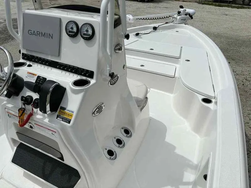 Slide: The Image of 2026 Blazer PureBay 2200 boat console with Garmin electronics and steering wheel. - 10